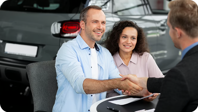 salesman and client at a dealership for no money down car loans