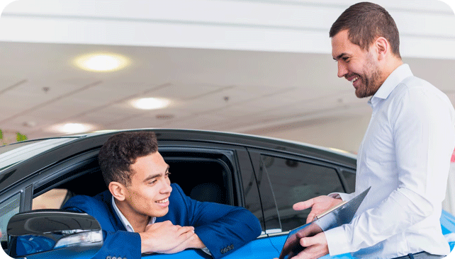 salesman and client discussing bad credit auto financing