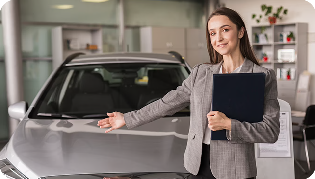 woman shows a car approved in Alberta with an auto finance