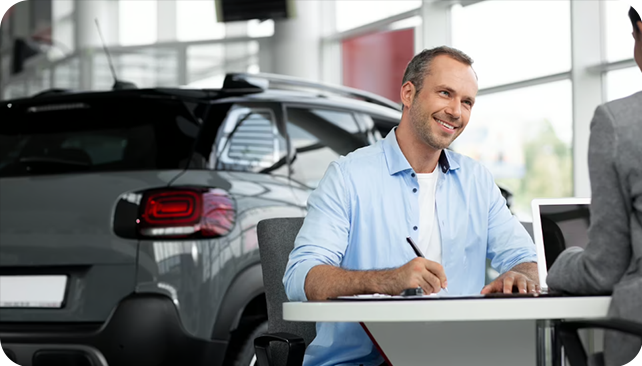 happy client accepting a zero down payment car loan